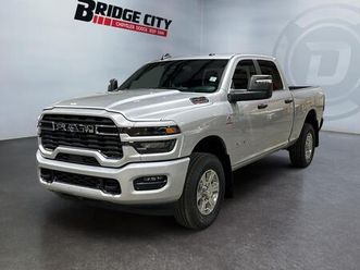 new 2026 ram 2500 big horn toyo open country tires wrapped around 20 fuel wheels