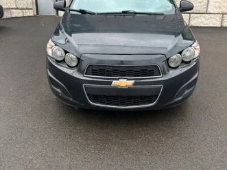 2015 black chev sonic hatchback lt