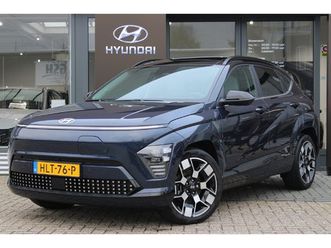 hyundai kona electric premium sky 65.4 kwh demo-deal! | achterstoelen verwarmd | cruise control adaptief met stop&go en stuurhulp | dodehoekdetectie met correct