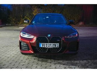 bmw i4 m50 - aventurinrot beinahe im neuwagenzustand