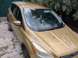 gold 4x4 ford escape