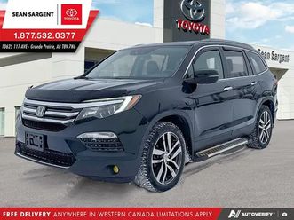 2017 honda pilot touring, fully loaded and dark green in color