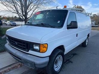 2007 ford e-250 commercial cargo van with shelves and ladder rack
