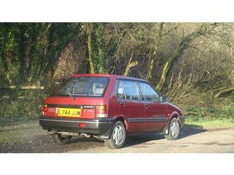 1994 subaru justy rouge foncé automatique conduite à droi...