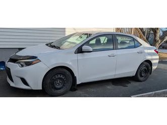 2014 toyota corolla ce + 4 brand new toyo winter tires on rims