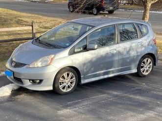 2011 honda fit — reliable car with 263,000 miles.