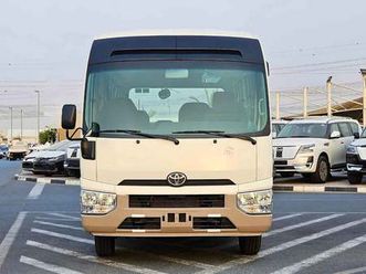 toyota coaster 2.7l petrol m/t dual tone / 23 seater / auto door / hlf luggage rack (code#copb)