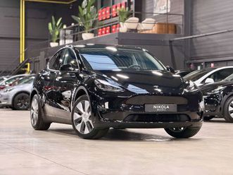 tesla model y rear wheel drive - full black - autopilot active