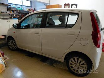 daihatsu cuore 2007 5p 1.0 c/clima,radio