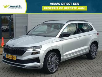 skoda karoq sportline business 150pk automaat i adaptive cruise control i 19 inch velgen i camera i navigatie i apple carplay/android auto