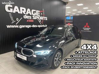 bmw touring 320e xdrive 204 ch bva8 business design (4x4) + attelage + sieges av chauffants + regulateur adaptatif + pack innovation + pack divertissement + ...