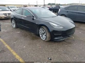 tesla model 3 long range/ performance