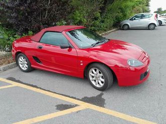 mgtf 1.6 solid red with black leather. dark bordeux red (new) hood. offers invited.