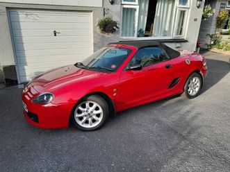 mgtf 1.6 solid red with black leather. dark bordeux red (new) hood