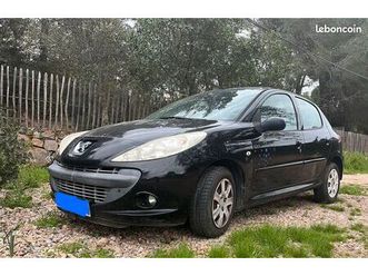 voiture noir et bleu peugeot 206+